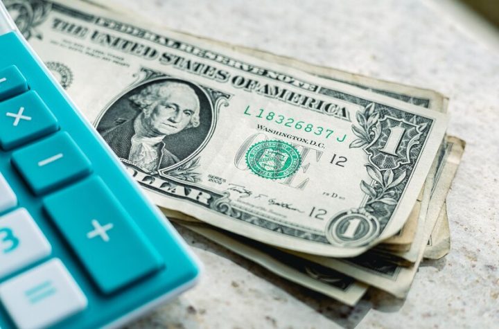 group-us-dollar-banknotes-blue-calculator_488935-1100